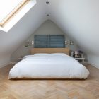 Loft Bedroom Low Triangular Loft Bedroom With Wood Low Profile Bed Warm Wood Floor Antique Metallic Wall Lights Warm White Duvet Cover Bedroom Natural White Duvet Cover For Simple Contemporary Bedrooms