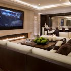 Home Living With Warm Home Living Room Featured With TV Studded On Center Wall With Fireplace Facing Large Sectional Sofas Decoration Swanky Large Sectional Sofas For Spacious Living Rooms (+16 New Images)