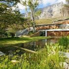 Long Pond Beautiful Wonderful Long Pond Outside The Beautiful Home Near The Green Grass Yard And Some Green Trees Architecture Breathtaking Mountain House Blends In With Fresh Landscape Environment