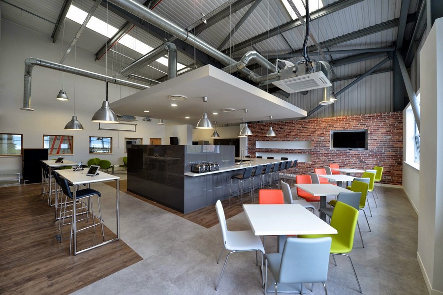 Architecture Design Modern Amazing Architecture Design Of NSG Modern Offices With Soft Grey Colored Concrete Floor And Several Colorful Chairs Dining Room Elegant And Modern Dining Room Sets With Wonderful Brick Walls