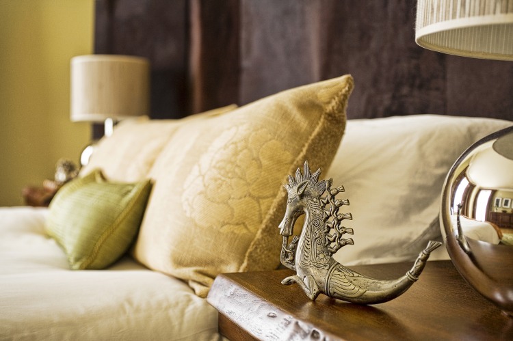 Dragon Statue Of Amazing Dragon Statue On Details Of Wooden Side Table At Modern Residence Bedroom That Applied Gold Floral Pillows Decoration Wonderful Traditional Interior Design For Unique Modern Residence