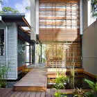 Wooden Accents Road Appealing Wooden Accents Of Storrs Road Residence Applied On Deck And Striped Drapes Beside Small Pool Outside House Decoration Amazing Floating Deck Concept For Luminous Modern House
