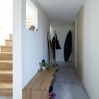 Wooden Long Emty Appealing Wooden Long Chair In Empty Space Of The House With White Interior Design In Hiyoshi Residence Architecture Beautiful Minimalist Home Decorating In Small Living Spaces