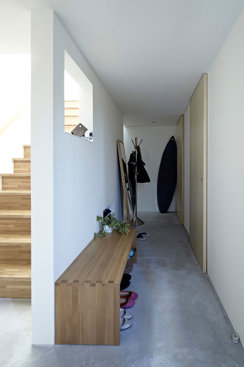 Wooden Long Emty Appealing Wooden Long Chair In Empty Space Of The House With White Interior Design In Hiyoshi Residence Architecture Beautiful Minimalist Home Decorating In Small Living Spaces