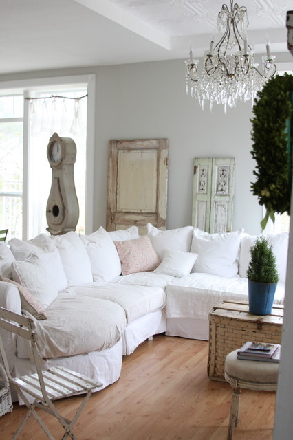 Living Room White Astonishing Living Room Design Applied White Sectional Sofa Slipcovers And Crystal Chandelier Above The Table Decoration Chic Sectional Sofa Slipcovers For Elegant Sofa Looks