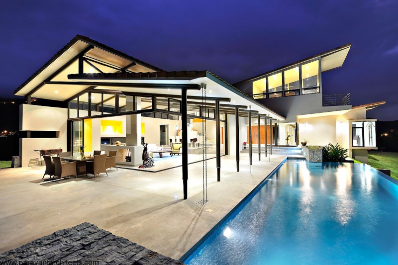 Building Design Residence Astounding Building Design Of Areopagus Residence With White Wall Made From Concrete And Several Black Colored Pillars Made From Wooden Material Dream Homes  Stunning Hill House Design With Sophisticated Lighting In Costa Rica