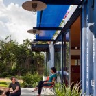 Blue Striped Terrace Attractive Blue Striped Ceiling Above Terrace In Front Yard Container Guest House Outside House With Potted Plants On Gray Floor Dream Homes Stunning Shipping Container Home With Stylish Architecture Approach