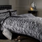 Double Animal Black Attractive Double Animal Print Zebra Black And White Duvet Covers On Black Tufted Headboard With Black Nightstand On Wooden Floor Bedroom Cozy Black And White Duvet Covers Collection For Comfortable Bedrooms