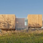 Facade View Two Attractive Facade View Of The Two Hulls House With Wooden Door And Wooden Wall Near Glass Wall Dream Homes Stunning Cantilevered Home With Earthy Tones Of Minimalist Interior Designs