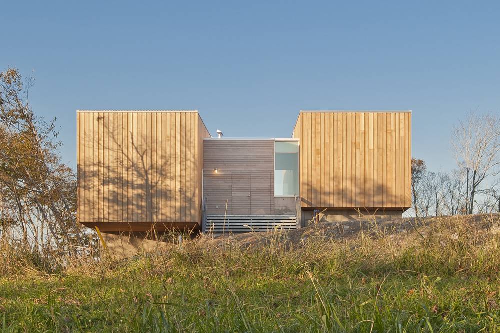 Facade View Two Attractive Facade View Of The Two Hulls House With Wooden Door And Wooden Wall Near Glass Wall Dream Homes Stunning Cantilevered Home With Earthy Tones Of Minimalist Interior Designs