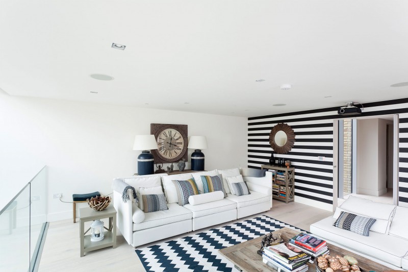 White Black Of Attractive White Black Striped Wall Of The Water Tower Residence Involved White Sofa Coupled With Twin Night Lamp On Table Dream Homes  An Old Water Tower Converted Into A Luminous Modern Home With Sliding Glass Walls