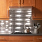 Metallic Stainless Tiled Awesome Metallic Stainless Steel Subway Tiled Backsplash Installed To Match The Grey Countertop Of Base Cabinet Kitchens Cozy Kitchen Backsplash With Sleek Cabinet And Chic Kitchen Tools