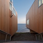 Blue Sea Two Beautiful Blue Sea Near The Two Hulls House With Wide Outdoor Wooden Staircase And Wooden Wall Dream Homes Stunning Cantilevered Home With Earthy Tones Of Minimalist Interior Designs