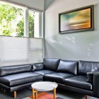 Living Room Black Breathtaking Living Room With Leather Black Sofas Facing White Table That Paint Wall Beside Glass Table Design Decoration Dramatic Yet Elegant Bold Black Sofas For Exquisite Interior Decorations