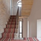 Ladder With And Captivating Ladder With Light Brown And Black Striped Carpet On It Installed Beside Bricks Patterned Wall Of The Water Tower Residence Dream Homes An Old Water Tower Converted Into A Luminous Modern Home With Sliding Glass Walls