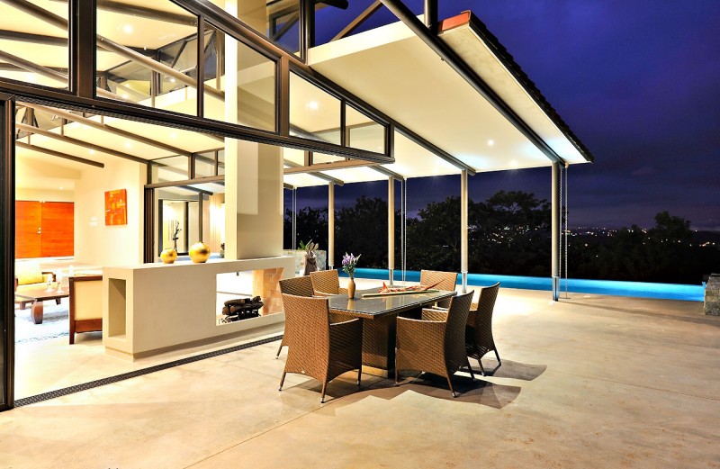 Outdoor Dining Of Captivating Outdoor Dining Space Design Of Areopagus Residence With Dark Brown Chairs Made From Rattan And Glass Panel Surface Of Dining Table Dream Homes  Stunning Hill House Design With Sophisticated Lighting In Costa Rica