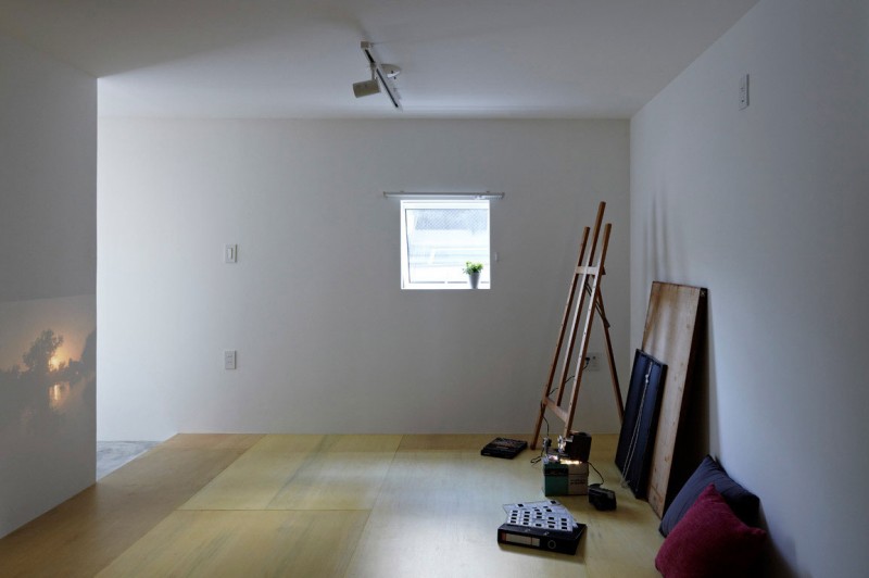 Painting Equipment Pillow Captivating Painting Equipment And Double Pillow Installed In Wooden Striped Floor With White Interior Design In Hiyoshi Residence Architecture  Beautiful Minimalist Home Decorating In Small Living Spaces