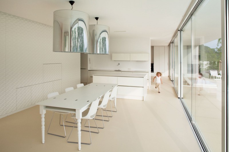 White Wooden With Captivating White Wooden Dining Desk With White Single Chairs Installed In The White Patterned Wall Of House L Residence Decoration Simple Home Design With Transparent Glass Wall And Bright Interiors