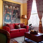 Decorative Mural Painted Charming Decorative Mural On Yellow Painted Wall Behind Red Sofa With Wooden Living Table In Eclectic Living Room Decoration 20 Vibrant And Bright Red Sofas For Chic Living Room With Personality
