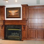 View In Mantel Clean View In The Fireplace Mantel With Wooden Cupboard In Brown Color That Lamp Turn On The Decor Fireplace 20 Impressive Fireplace Mantel For Stunning Living Room Designs