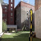 Green Grass The Comfortable Green Grass Yard In The Artist Residence Roof Space With Unusual Ornaments And Concrete Staircase Decoration Elegant Home Decorated With Artistic And Contemporary Living Spaces