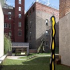 Green Grass The Comfortable Green Grass Yard In The Artist Residence Roof Space With Unusual Ornaments And Concrete Staircase Decoration Elegant Home Decorated With Artistic And Contemporary Living Spaces