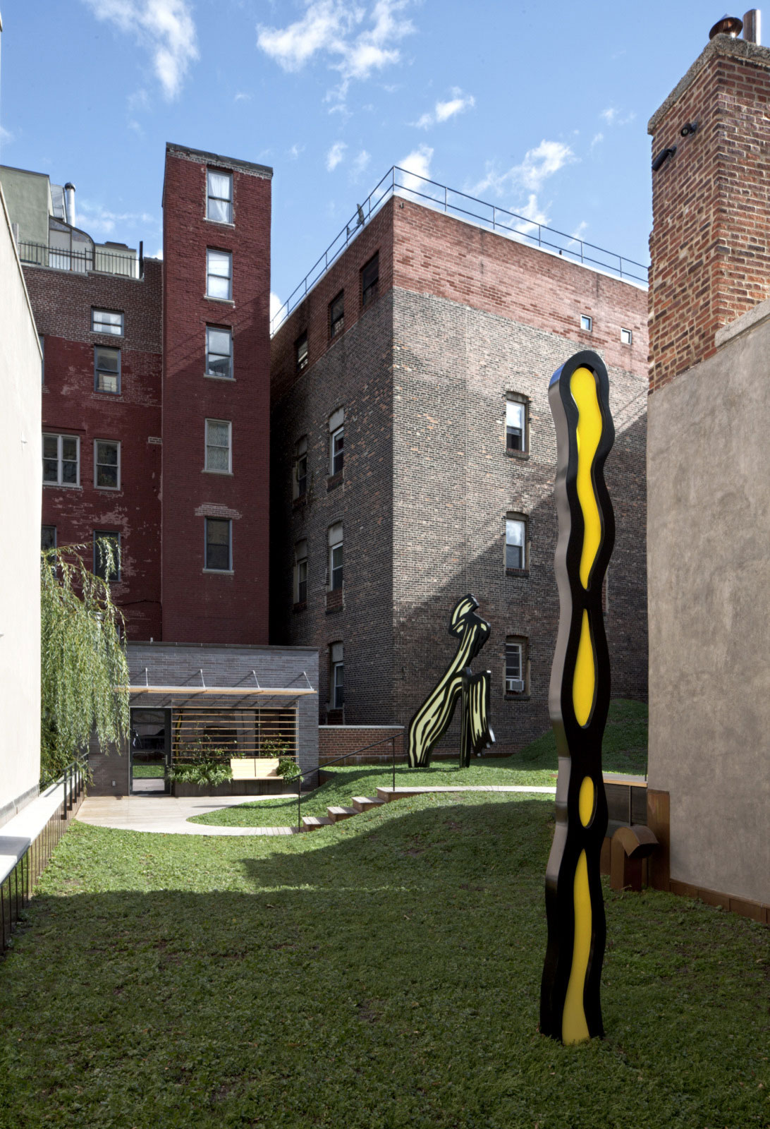 Green Grass The Comfortable Green Grass Yard In The Artist Residence Roof Space With Unusual Ornaments And Concrete Staircase Decoration Elegant Home Decorated With Artistic And Contemporary Living Spaces