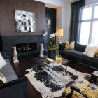 Living Room Sofas Cool Living Room With Black Sofas Facing Glass Table And Kangaroo Sculpture Opposited By Fire Place Design Decoration Dramatic Yet Elegant Bold Black Sofas For Exquisite Interior Decorations