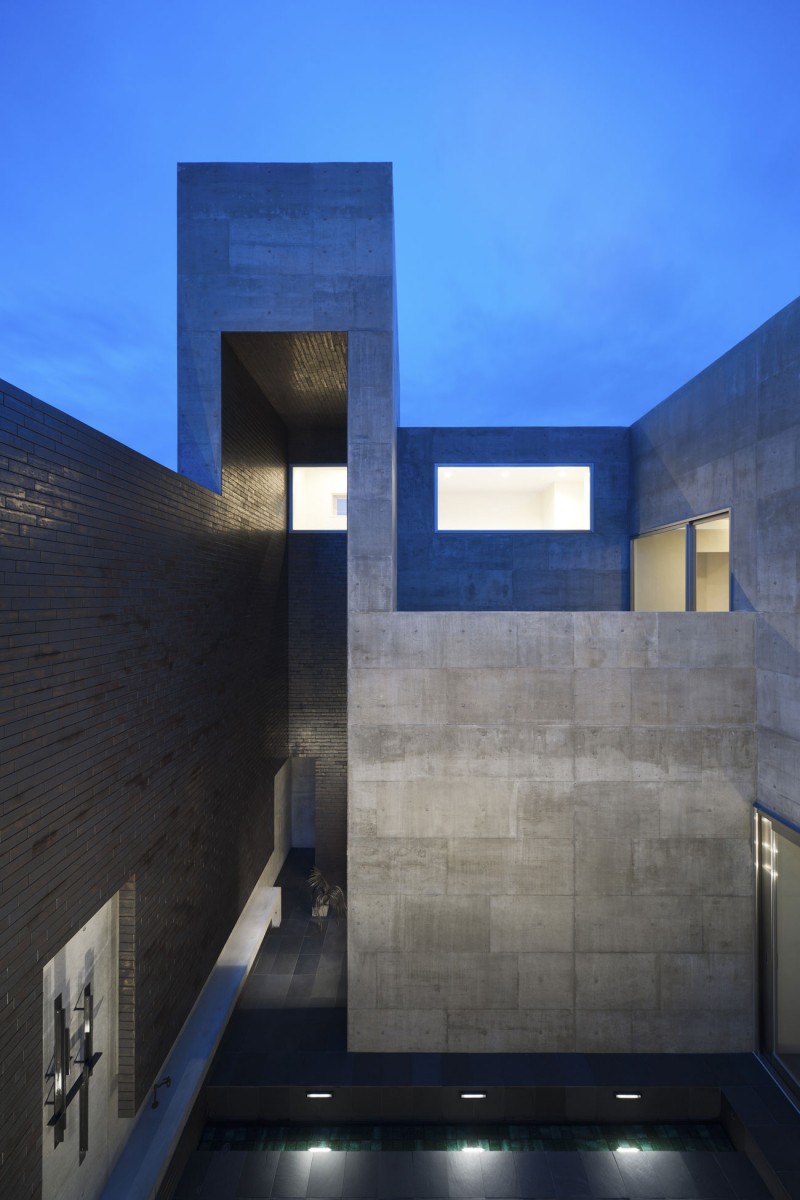 Two Floor Silence Cool Two Floor House Of Silence Building Idea Covered By Stone Veneer Seen By Evening Illuminated By Ground Lamps Dream Homes Sophisticated Modern Japanese Home With Concrete Construction Of Shiga Prefecture