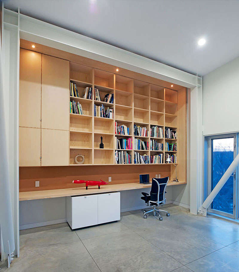 Home Office Two Cozy Home Office Inside The Two Hulls House With Long Wooden Desk And Many Wooden Bookshelves Dream Homes Stunning Cantilevered Home With Earthy Tones Of Minimalist Interior Designs