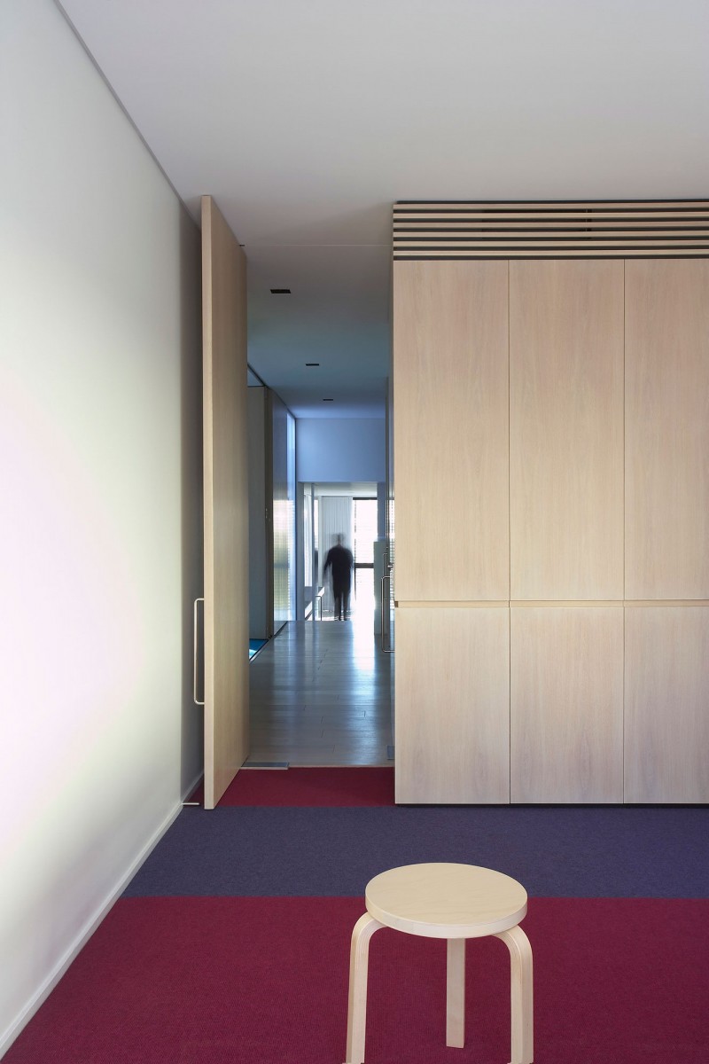 Small Wood Colorful Cozy Small Wood Bar Stool On Colorful Carpet Minimalist Wood Wardrobe In Stunning Luff Residence Wood Door With Metallic Knob Architecture Astonishing Contemporary Concrete Home With Minimalist Interior Features