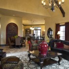 Living Room Sofas Crowded Living Room With Black Sofas Feat Red And Taupe Pillows Facing Wooden Table Under Chandelier Decor Decoration Dramatic Yet Elegant Bold Black Sofas For Exquisite Interior Decorations