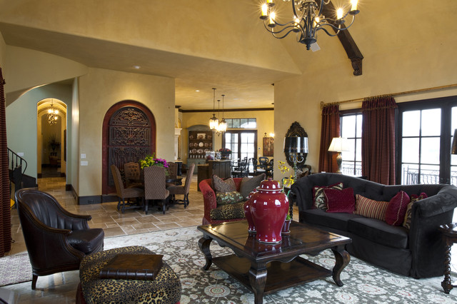 Living Room Sofas Crowded Living Room With Black Sofas Feat Red And Taupe Pillows Facing Wooden Table Under Chandelier Decor Decoration  Dramatic Yet Elegant Bold Black Sofas For Exquisite Interior Decorations