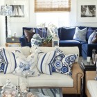 Blue Sofas Facing Cute Blue Sofas With Pillows Facing Glass The Table Feat Ashtray And Porcelains In Transparent Pattern Furniture Cool Blue Sofas Generate Breezy Impression In Your Living Room