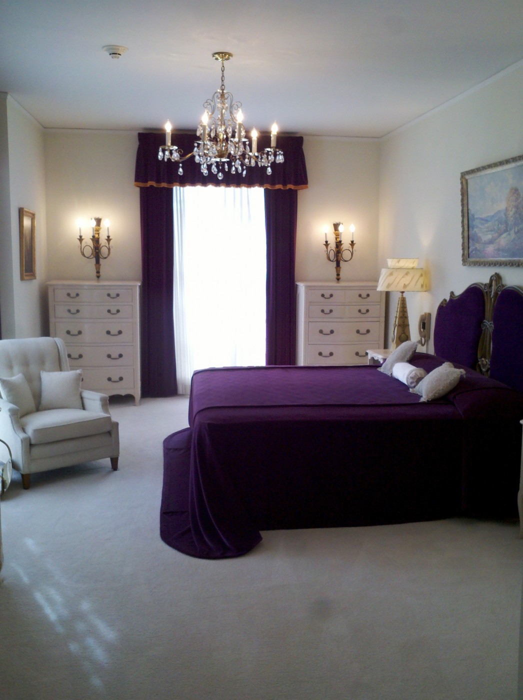 Purple Bedroom Dark Easy Purple Bedroom With Crisp Dark Purple Bed And Cozy Purple Headboard Under Turquoise Crystal Chandelier Plus Cute White Simple Single Sofa And Lovely White Drawer Palette Bedroom  26 Bewitching Purple Bedroom Design For Comfort Decoration Ideas