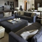 Home Family Furnished Eclectic Home Family Room Idea Furnished With Dark Grey Colored Sofas Ottoman And White Storage Stools Decoration Bright And Cheerful Home Decorating With Beautiful Sofa Furniture