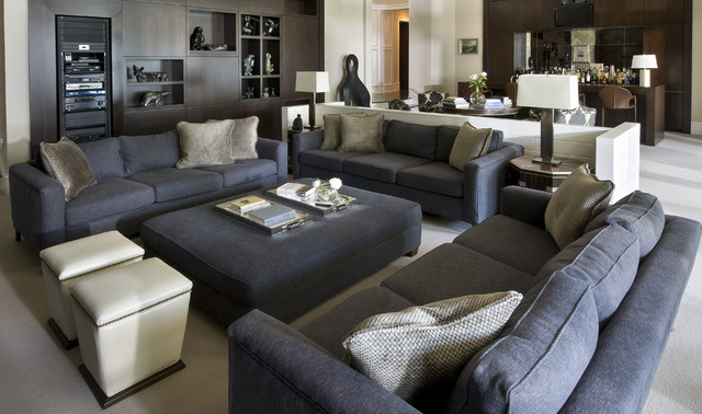 Home Family Furnished Eclectic Home Family Room Idea Furnished With Dark Grey Colored Sofas Ottoman And White Storage Stools Decoration Bright And Cheerful Home Decorating With Beautiful Sofa Furniture