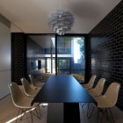 Luff Residence Dark Eclectic Luff Residence Interior With Dark Dining Table Floral Shaped Pendant Light White Acrylic Chairs Wood Floor Architecture Astonishing Contemporary Concrete Home With Minimalist Interior Features