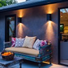 Patio Exterior With Eclectic Patio Exterior Design Furnished With Decorative Wooden Outdoor Sofa And Wooden Living Desk With Candle Holder On It Decoration Various Outdoor Sofa Furniture For Modern Home Exteriors