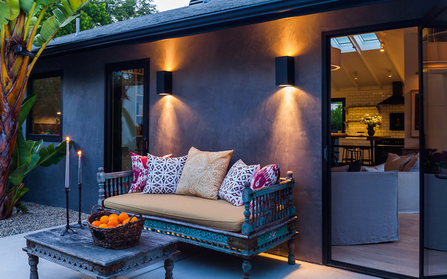 Patio Exterior With Eclectic Patio Exterior Design Furnished With Decorative Wooden Outdoor Sofa And Wooden Living Desk With Candle Holder On It Decoration Various Outdoor Sofa Furniture For Modern Home Exteriors