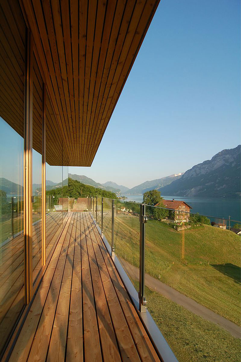 Balcony Design Am Enchanting Balcony Design Of Wohnhaus Am Walensee Residence With Soft Brown Wooden Floor And Transparent Handrail Made From Glass Material Architecture Beautiful Rectangular Lake Home With Wood And Concrete Elements