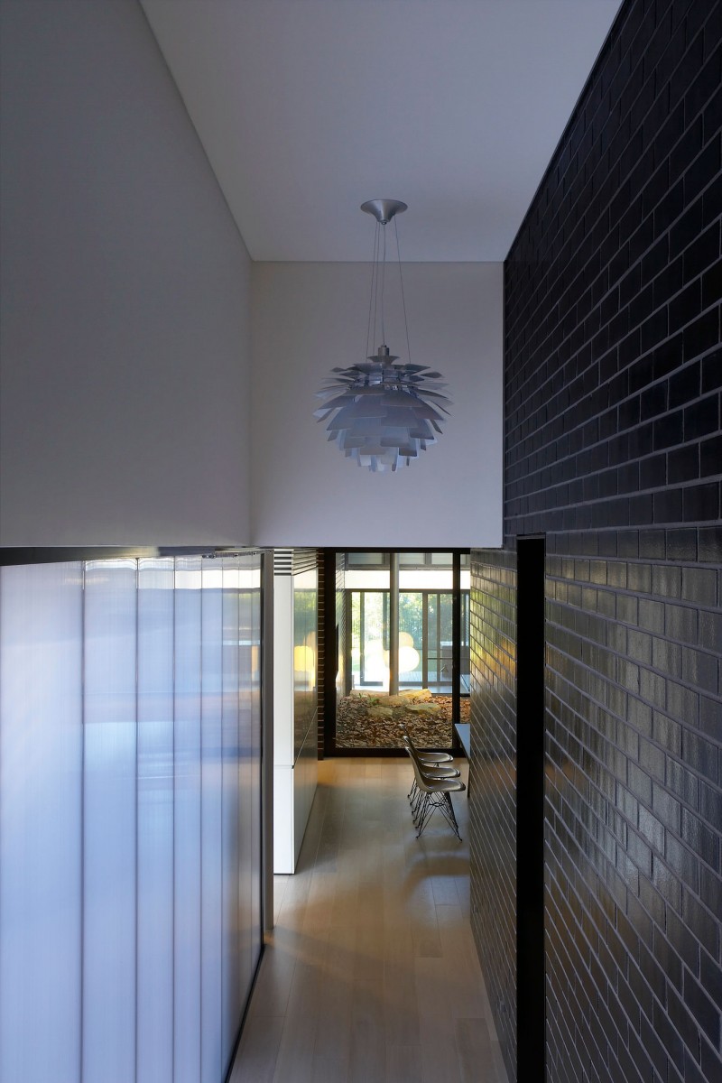 Floral Shaped In Enchanting Floral Shaped Pendant Light In Small Luff Residence Dark Brick Wall Warm Wood Floor White Acrylic Chairs Transparent Glass Wall Architecture  Astonishing Contemporary Concrete Home With Minimalist Interior Features