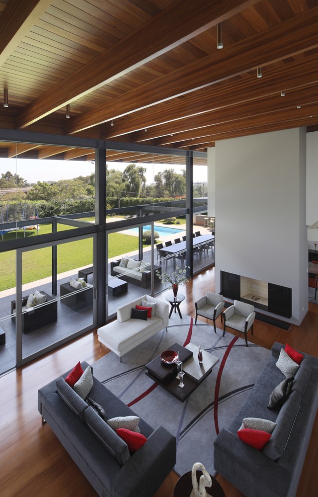 Living Room Dark Enchanting Living Room Design With Dark Grey Colored Sofa And Soft Grey Colored Rug Carpet On The Floor Dream Homes Gorgeous Contemporary Home With Rectangular Structure And Large Glass Walls