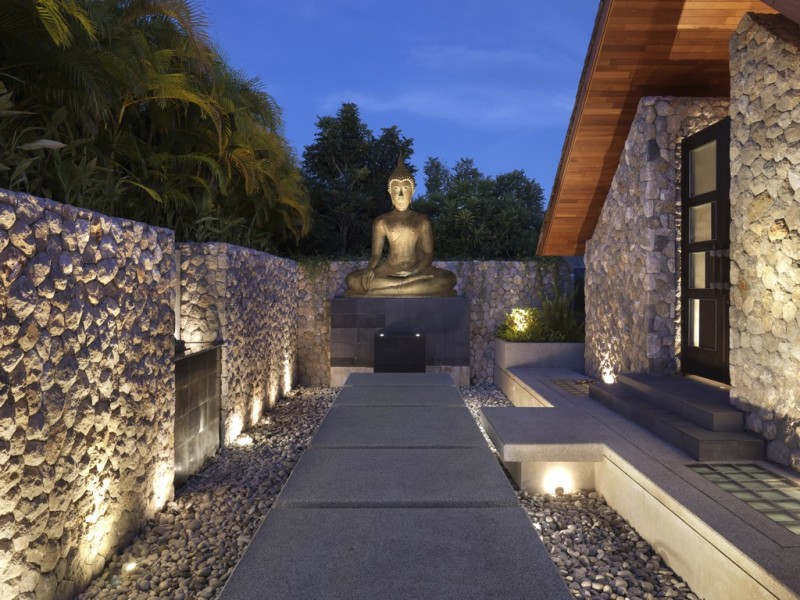 Outyard Landscape Oceanfront Excellent Courtyard Landscape Design Of Oceanfront Villa Kamala With Grey Colored Floor Made From Concrete Blocks And Big Statue Of Buddha Architecture  Luminous Oceanfront Home With Magnificent Natural Views