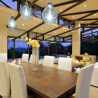 Dining Space Areopagus Exciting Dining Space Design Of Areopagus Residence With White Colored Chairs And Several Soft Blue Pendant Lamp Covers Hanged In The Ceiling Dream Homes Stunning Hill House Design With Sophisticated Lighting In Costa Rica