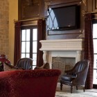 Living Room The Exciting Living Room Design With The Brown Color And Red Chairs Facing The Wooden Table And The Fireplace Mantel Kits Under The Led TV Fireplace Elegant Fireplace Mantel Kits For Chic Living Room And Dining Rooms