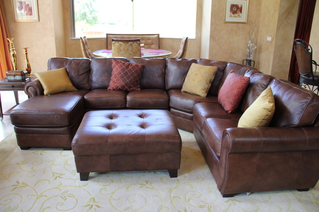 Traditional Family With Exciting Traditional Family Room Design With Dark Brown Colored Leather Sectional Sofa Several Pillows And Dark Brown Ottoman Table Decoration 20 Brilliant Leather Sectional Sofas That Will Fit Stunningly Into Your Family Home