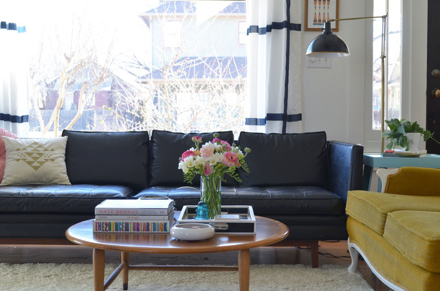 Eclectic Living Black Fabulous Eclectic Living Room With Black Sofas Facing Wooden Table Feat Flower Beside The Books And Ashtray Also Decoration Dramatic Yet Elegant Bold Black Sofas For Exquisite Interior Decorations