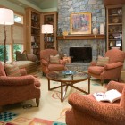 Living Room Soffas Fabulous Living Room With Orange Sofas Facing The Glass Table And The Fireplace Mantel Shelves Under The Photos Decor Decoration Functional Modern Home With Fireplace Mantel Shelves And Creative Lightings