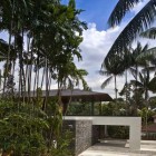 Water Cooled View Fabulous Water Cooled House Facade View Displaying Lush Vegetation And Concrete Stone Fence Surrounding The House Decoration Elegant And Beautiful Home Design Presented By The Water-Cooled House